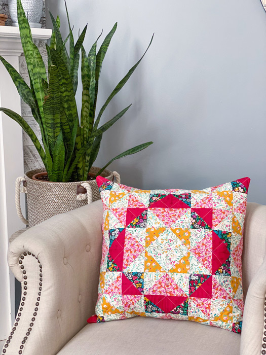 Cushion adapted from the Maizie quilt pattern by Penelope Handmade Tamarack jacket by Grainline Studio using The Flower Society 100% cotton patchwork and quilting fabric by Art Gallery Fabrics